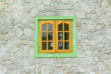 wooden window with stone wall