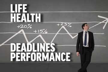 Composite image of handsome businessman leaning