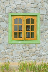 wooden window with stone wall