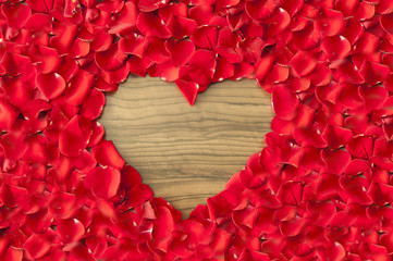 Heart shaped hole in rose petals - love and valentine background