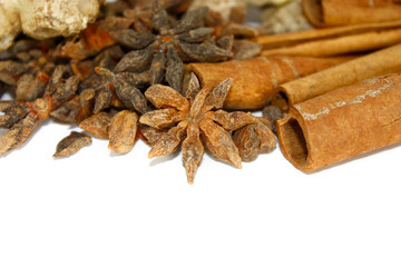 Ginger, cinnamon and star anise isolated on white