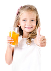 Happy little girl with glass of juice and finger up