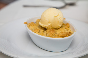 Apple Tart in Bowl with Scoop of Vanilla Ice Cream