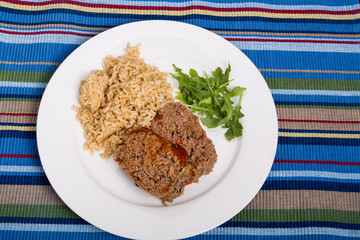 Meatloaf Rice and Arugula on Striped Placemat