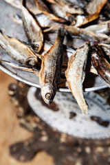 Dried fish on the old weighing scale