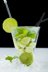 Mojito cocktail with limes and mint