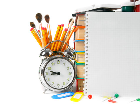 Notebook and school accessories. On white background.