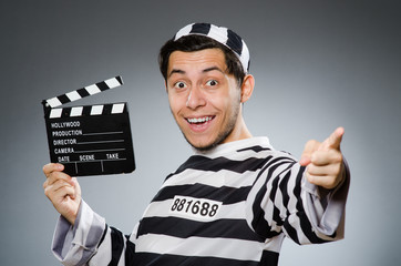 Inmate with movie clapper board