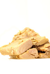 Group of pieces of tuna in olive oil