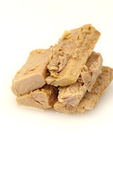 Group of pieces of tuna in olive oil