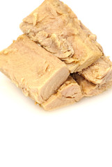 Group of pieces of tuna in olive oil