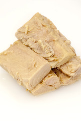 Group of pieces of tuna in olive oil