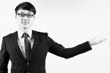 Successful young business man of Asian, full length portrait iso