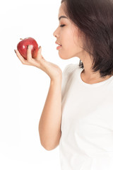 Smiling woman with apple isolated on white