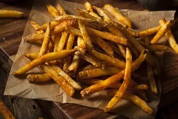 Zelfklevend Fotobehang Cajun Seasoned French Fries © Brent Hofacker