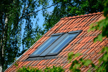 Roof windows in green garden