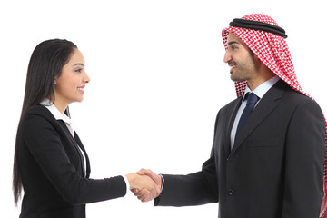 Side view of an arab saudi businesspeople handshaking