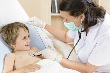 Fototapeta premium Doctor consulting a little boy