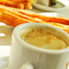 cafe y porras, coffee and thick churros, the typical breakfast i