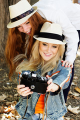 Two teenagers girl taking selfe with camera