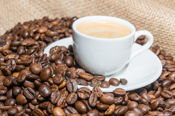 coffee beans and cup of coffee. Selective focus.