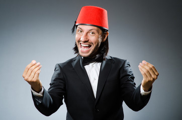 Man in traditional turkish hat and dress