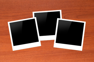 Blank Picture Frames on Wooden Table