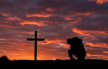 Man In Pray Cross