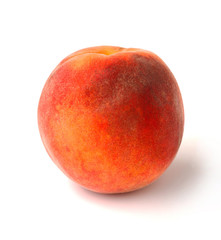 Single peach on a white background