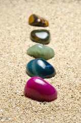 Fototapeta na wymiar minerals and precious gems in the sand