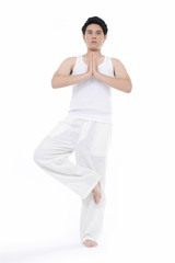 young man in yoga position. Studio portrait