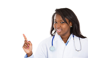 Female doctor pointing at copy space on white background 