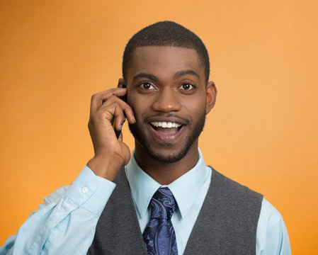Happy business man, young guy talking on mobile phone smiling