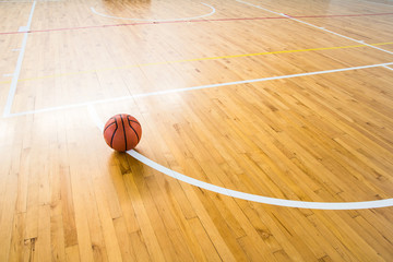 Basketball ball over floor in the gym