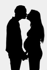 young couple expecting a baby- silhouette