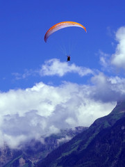 Fototapeta na wymiar paragliding, parachute over the mountain