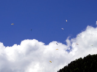 paragliding, parachute over the mountain