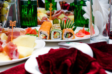 Assorted gourmet sushi rolls on a buffet