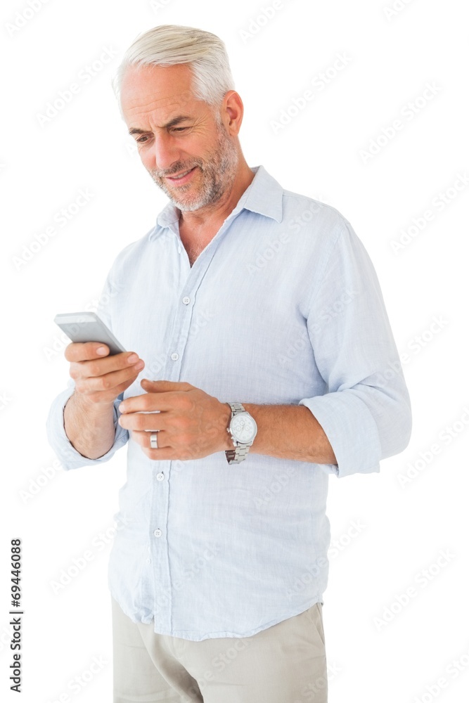 Leinwandbilder smiling man sending a text message