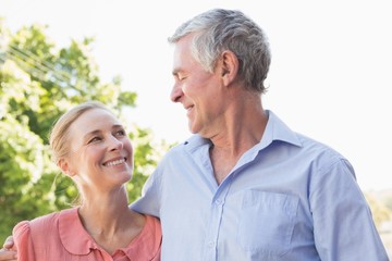 Senior couple smiling at each other