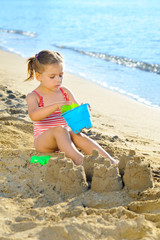 Toddler girl at beach