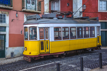 Fototapeta na wymiar Vintage yellow tram, symbol of Lisbon, Portugal