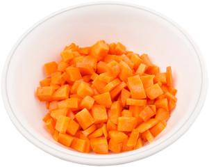 Chopped carrot in a bowl over white background