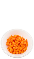 Chopped carrot in a bowl over white background