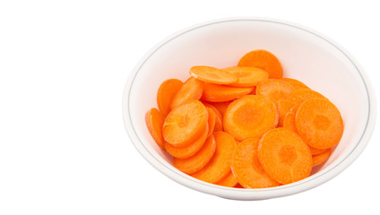 Chopped carrot in a bowl over white background