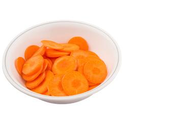 Chopped carrot in a bowl over white background