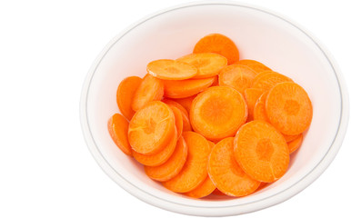 Chopped carrot in a bowl over white background
