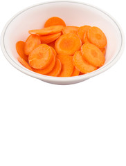 Chopped carrot in a bowl over white background