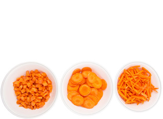 Different style of chopped carrots in white bowls