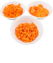 Different style of chopped carrots in white bowls